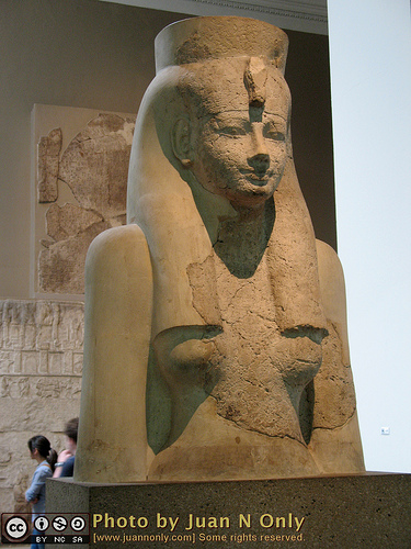 Ancient Egyptian statue displayed in museum.