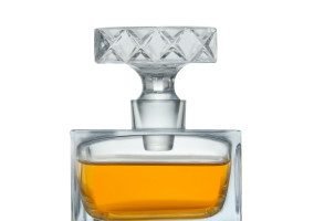 Crystal decanter filled with amber liquid.
