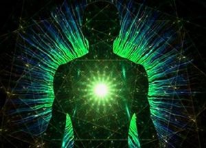 Silhouette with glowing green energy center.
