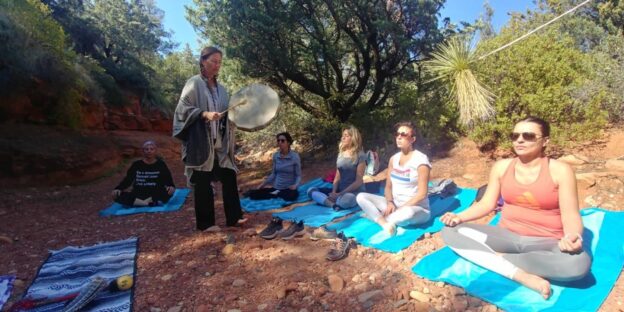Outdoor meditation group with drum session.