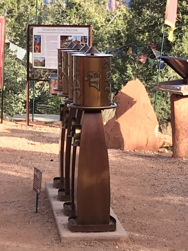 Prayer wheels in an outdoor setting.